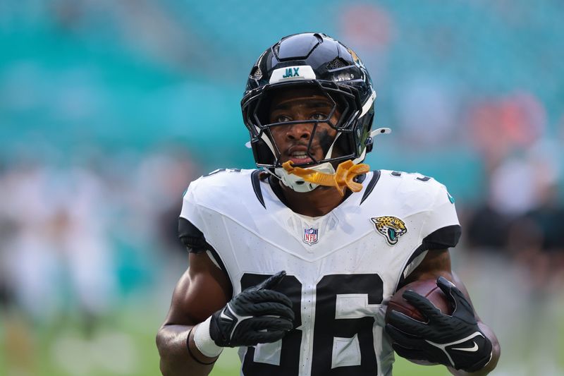 Aug 23, 2025; Miami Gardens, Florida, USA; Jacksonville Jaguars running back LeQuint Allen Jr. (36) warms up before the game against the Miami Dolphins at Hard Rock Stadium. Mandatory Credit: Sam Navarro-Imagn Images