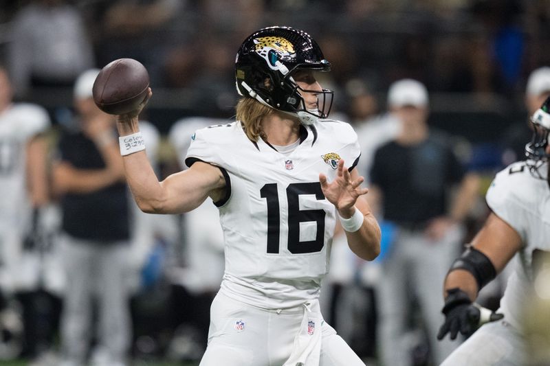 Aug 17, 2025; New Orleans, Louisiana, USA; Jacksonville Jaguars quarterback Trevor Lawrence (16) throws during the first half against the New Orleans Saints at Caesars Superdome. Mandatory Credit: Matthew Hinton-Imagn Images