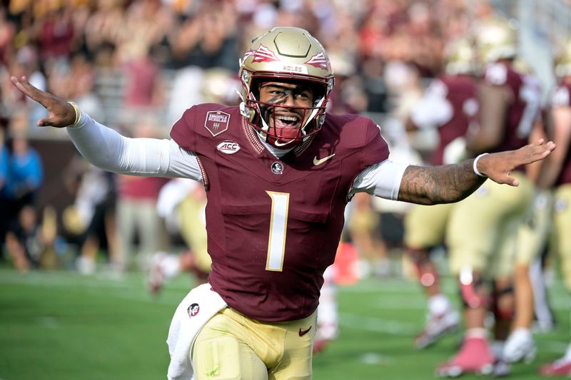 Aug 30, 2025; Tallahassee, Florida, USA; Florida State Seminoles quarterback Tommy Castellanos (1) celebrates after a touchdown against the Alabama Crimson Tide during the second half at Doak S. Campbell Stadium. Mandatory Credit: Melina Myers-Imagn Images