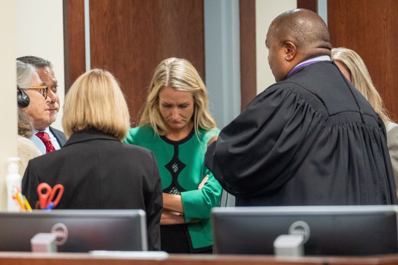 Donna Adelson, left, participates in a sidebar asked for by her defense team Wednesday, Sept. 3, 2025.