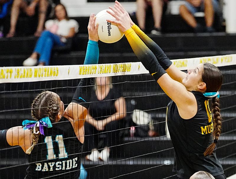 Camille Moller of Bayside is blocked at the net by Lydia Scott of Merritt Island during their match September 3, 2025. Craig Bailey, FLORIDA TODAY via USA TODAY NETWORK