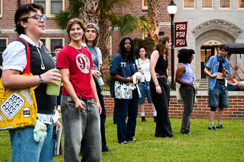 Competitors for the title of "Most Performative Masc" line up on Landis Green.