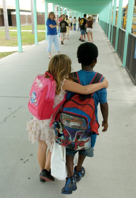 Students and teachers at Laurel Nokomis School celebrated the last day of school Tuesday afternoon, May 23, 2006,to the music of Kool and the Gang’s song, “Celebration” as students waved goodbye to their teachers. About 1200 students were let out about 2:45 p.m. to start their summer vacation. Kassidy Valleau,7, puts her arm around her classmate friend Kolbie Ward,7, as they said goodbye for the summer.