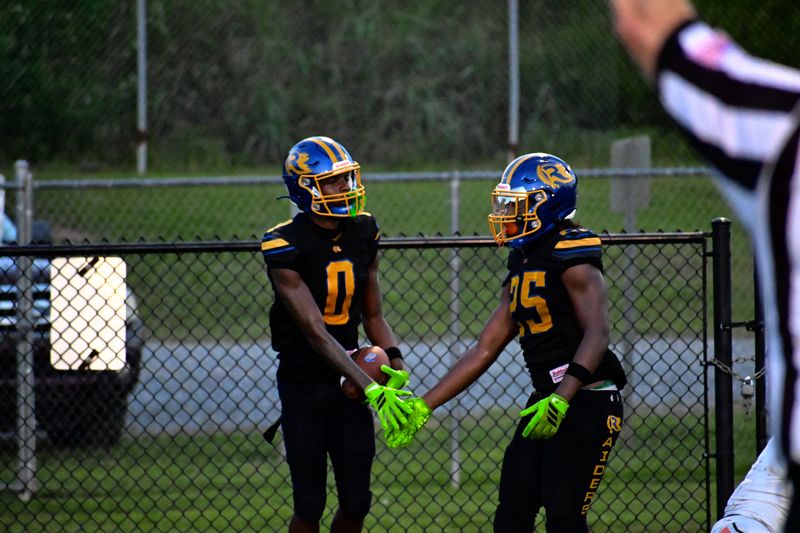 Rickards Raiders wide receiver Davion Crumitie (0) celebrates after a play with teammate Terron Atkins versus the Mosley Dolphins in a Week 3 FHSAA football matchup at Gene Cox Stadium in Tallahassee, Florida, Friday, Sept. 5, 2025.