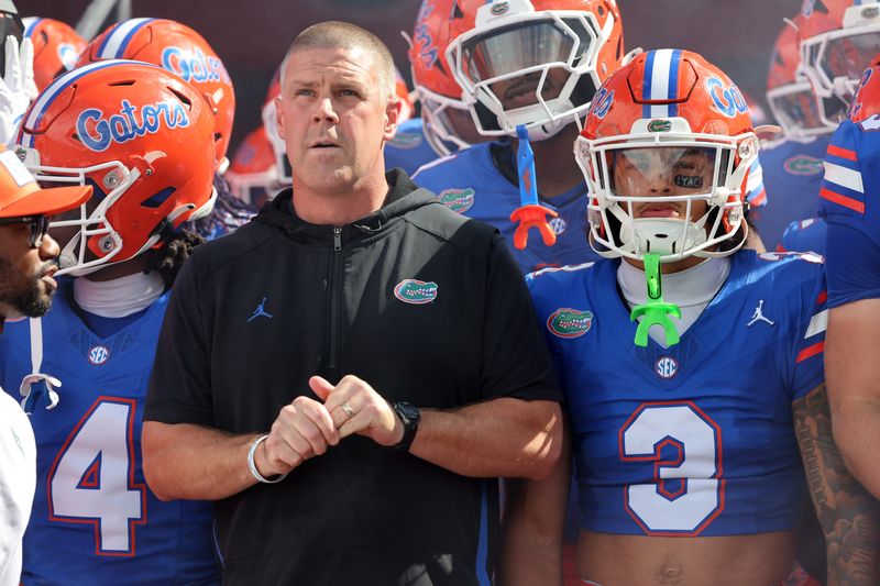 Sep 6, 2025; Gainesville, Florida, USA; Florida Gators head coach Billy Napier and teammates run out of the tunnel prior to the game against the South Florida Bulls at Ben Hill Griffin Stadium. Mandatory Credit: Kim Klement Neitzel-Imagn Images