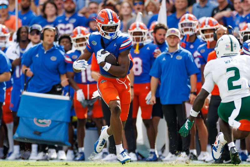 Sep 6, 2025; Gainesville, Florida, USA; Florida Gators wide receiver J. Michael Sturdivant (9) runs against the South Florida Bulls during the first half at Ben Hill Griffin Stadium. Mandatory Credit: Matt Pendleton-Imagn Images