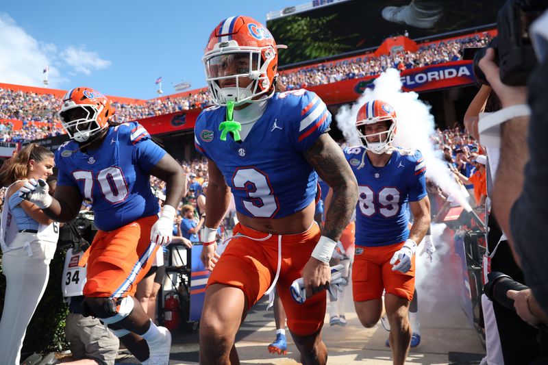 Sep 6, 2025; Gainesville, Florida, USA; Florida Gators wide receiver Eugene Wilson III (3) and teammates run out of the tunnel prior to the game against the South Florida Bulls at Ben Hill Griffin Stadium. Mandatory Credit: Kim Klement Neitzel-Imagn Images