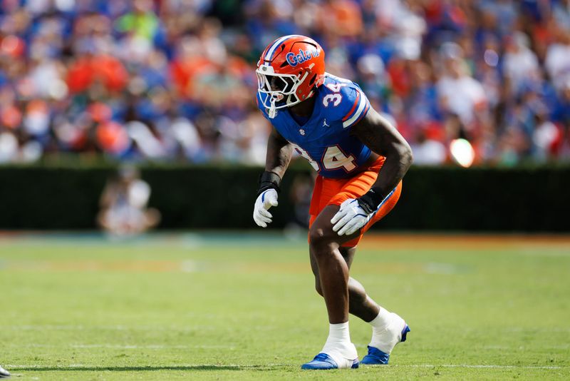 Sep 6, 2025; Gainesville, Florida, USA; Florida Gators defensive end George Gumbs Jr. (34) waits for the snap against the South Florida Bulls during the first half at Ben Hill Griffin Stadium. Mandatory Credit: Matt Pendleton-Imagn Images