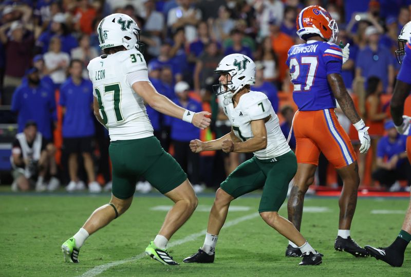 Sep 6, 2025; Gainesville, Florida, USA; South Florida Bulls place kicker Nico Gramatica (7) celebrates after he kicks the game winning field goal as time expires to beat the Florida Gators at Ben Hill Griffin Stadium. Mandatory Credit: Kim Klement Neitzel-Imagn Images