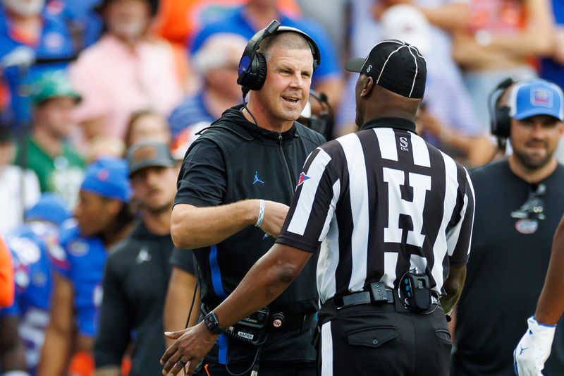 Sep 6, 2025; Gainesville, Florida, USA; Florida Gators head coach Billy Napier discusses a call with the referee against the South Florida Bulls during the first half at Ben Hill Griffin Stadium. Mandatory Credit: Matt Pendleton-Imagn Images