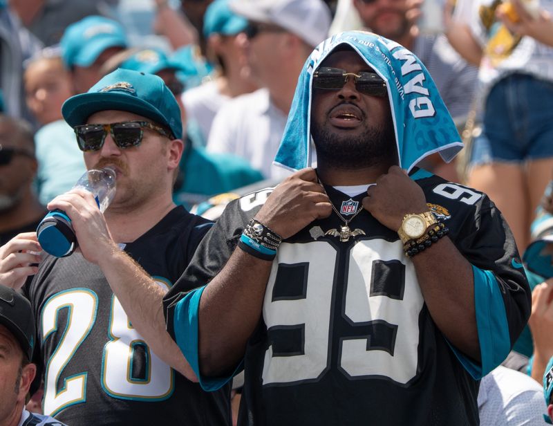 Jaguar fans try to beat the heat during the first quarter of an NFL football game between the Carolina Panthers at Jacksonville Jaguars at EverBank Stadium Sunday September 7, 2025. [Doug Engle/Florida Times-Union]