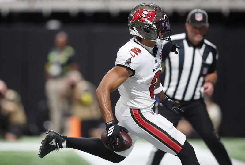 Sep 7, 2025; Atlanta, Georgia, USA; Tampa Bay Buccaneers wide receiver Emeka Egbuka (2) scores a touchdown against the Atlanta Falcons during the fourth quarter at Mercedes-Benz Stadium. Mandatory Credit: Brett Davis-Imagn Images