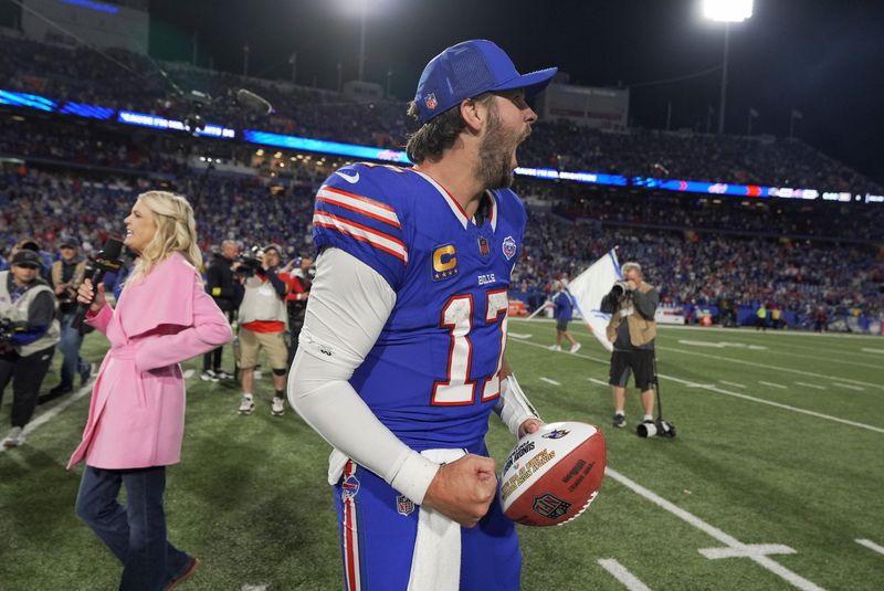 Buffalo Bills quarterback Josh Allen yells after his team won 41-40 in the final seconds against the Baltimore Ravens at Highmark Stadium in Orchard Park on Sept. 7, 2025. He received a Sunday night football which he later through to fans in the stands.