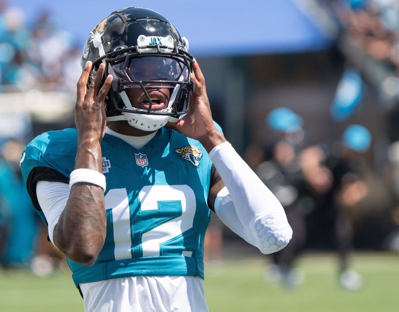 Jacksonville Jaguars wide receiver Travis Hunter (12) takes a breath while warming up before the start of an NFL football game between the Carolina Panthers at Jacksonville Jaguars at EverBank Stadium Sunday September 7, 2025. [Doug Engle/Florida Times-Union]