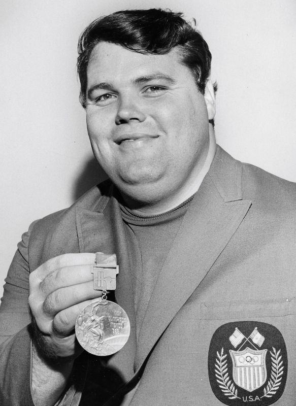 Joe Dube holds his Olympic bronze medal on June 23, 1969, in preparation for the World Weightlifting Championships. [Ray Stafford/Florida Times-Union file]