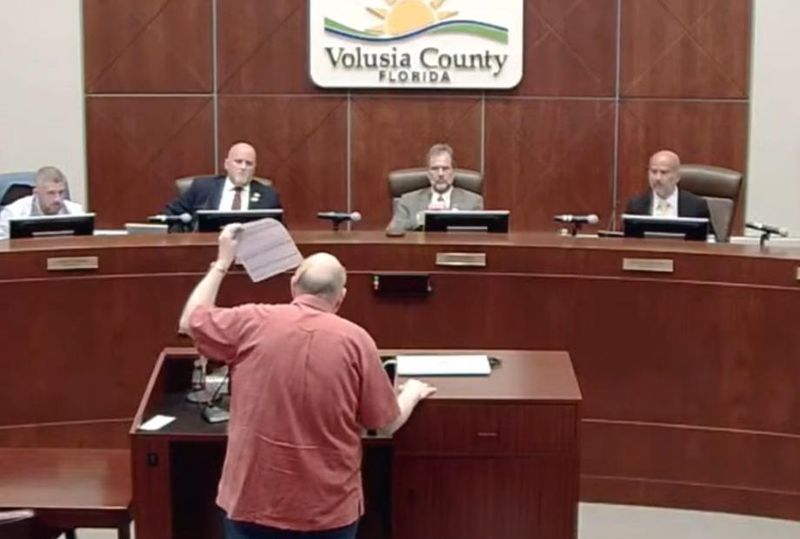 David Nadler raises his tax bill during Volusia County's first budget hearing on Sept. 4. Nadler said his tax bill is $4,000.
