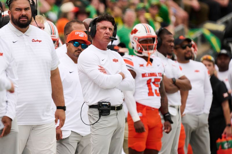 Oklahoma State head coach Mike Gundy looks up from the sidelines during the first half of the Cowboys' loss to Oregon in Eugene, Oregon, on Saturday, Sept. 6.