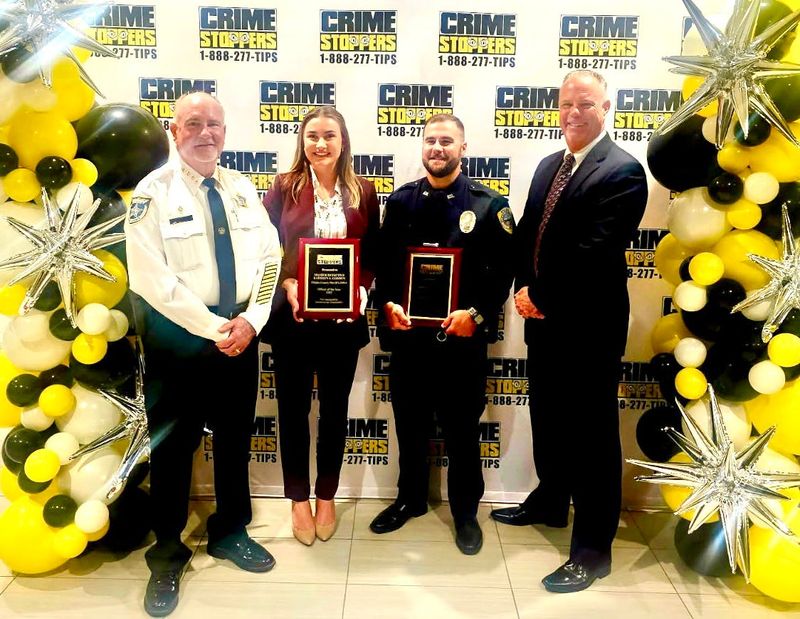 Flagler County Sheriff Rick Staly, Sheriff's Office Master Detective Kathryn Gordon, Flagler Beach Police Officer Michael Snyder and Police Chief Matt Doughney. Gordon and Snyder were honored as regional officers of the year by Crime Stoppers for their agencies.
