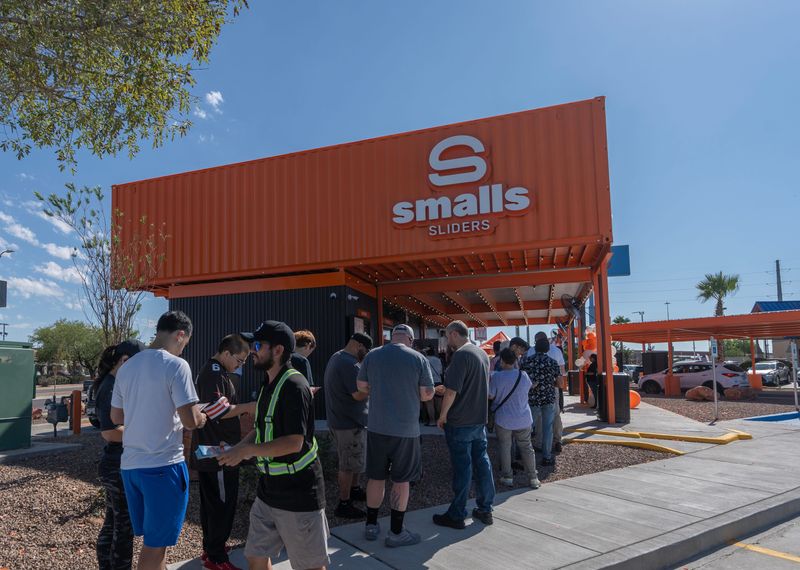 Customers wait in line during the grand opening of Smalls Sliders in El Paso, Texas, on Monday, Sept. 9, 2025. The event was attended by city officials, including District 6 City Representative Art Fierro and Mayor Renard Johnson.