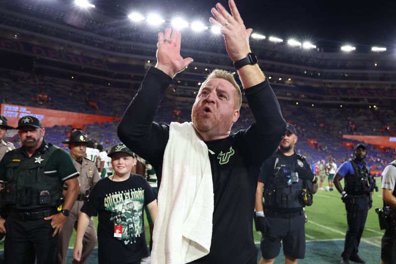 South Florida Bulls head coach Alex Golesh celebrates Sept. 6, 2025, after they beat the Florida Gators at Ben Hill Griffin Stadium in Gainesville, Florida. Mandatory Credit: Kim Klement Neitzel-Imagn Images