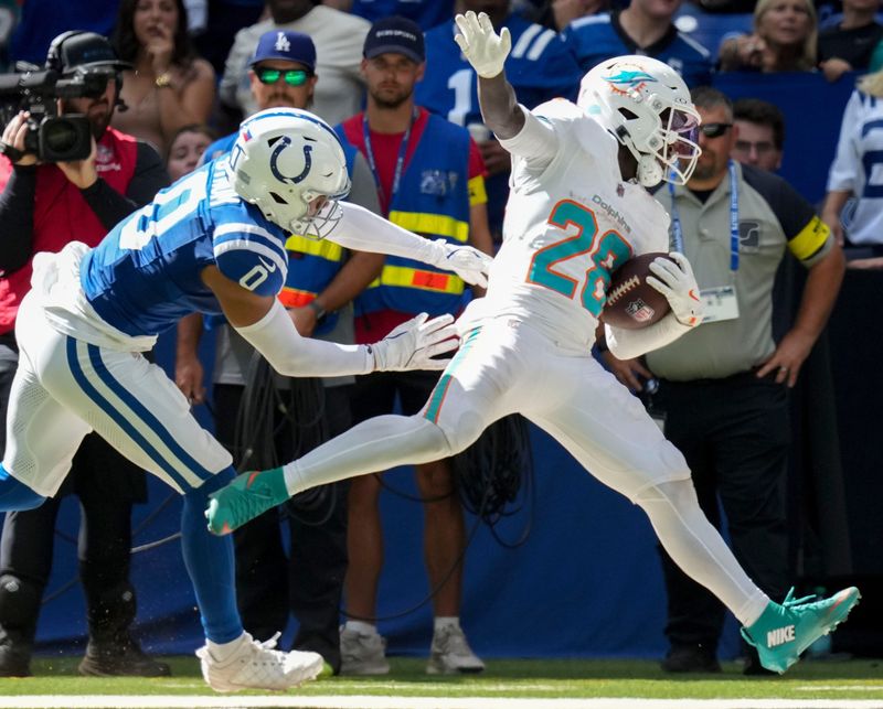 Indianapolis Colts safety Camryn Bynum (0) pushes Miami Dolphins running back De'Von Achane (28) during the second half of a game Sunday, Sept. 7, 2025, at Lucas Oil Stadium in Indianapolis. The Colts defeated the Dolphins 33-8.