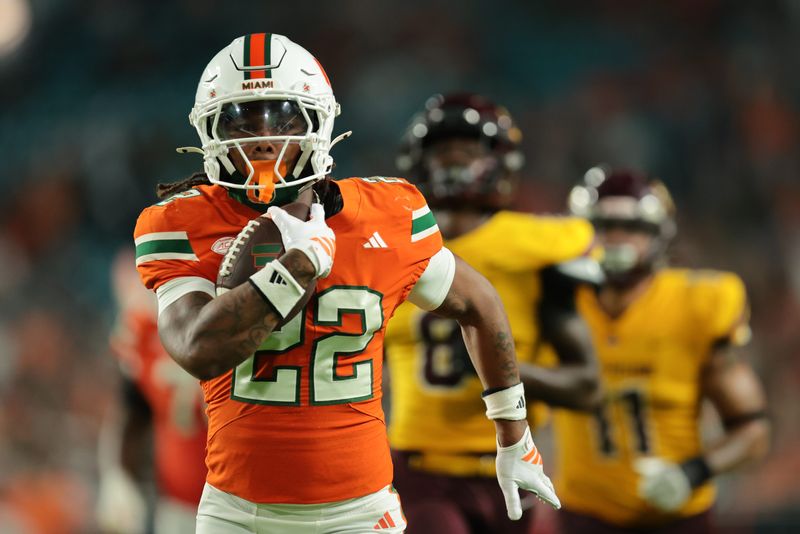 Miami Hurricanes running back Girard Pringle Jr. (22) runs with the football for a touchdown Sept. 6, 2025, against the Bethune-Cookman Wildcats during the fourth quarter at Hard Rock Stadium in Miami Gardens, Florida. Mandatory Credit: Sam Navarro-Imagn Images