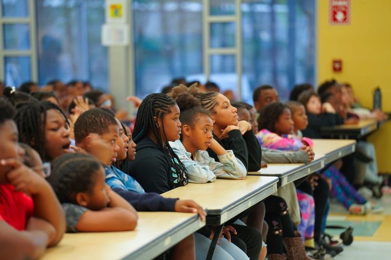 Pineview Elementary School students celebrating literacy with attentiveness at the Accelerated Reader Reading Rally.