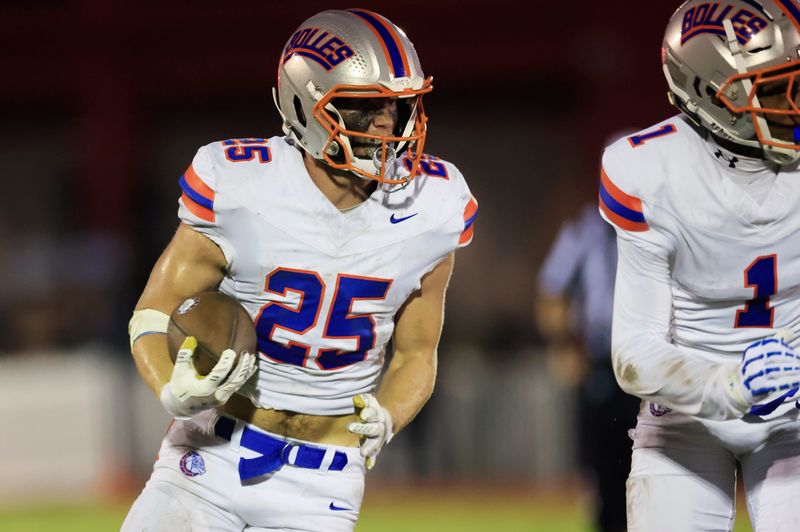 Bolles' Xander Edwards (25) rushes for yards during the second quarter of a high school football matchup at Bishop Kenny High School, Friday, Sept. 12, 2025, in Jacksonville, Fla. The Bolles Bulldogs blanked the Bishop Kenny Crusaders 36-0.