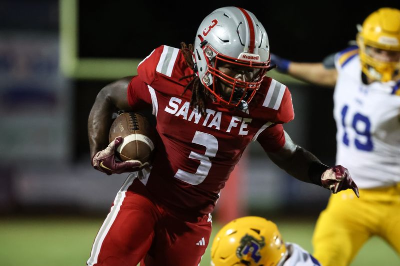Santa Fe Raiders player Jasiah Powell (3) runs with the ball during the first half of a football game between Santa Fe High School and Palatka High School at Santa Fe High School in Alachua, FL on Friday, September 12, 2025. [Chris Watkins/Gainesville Sun]