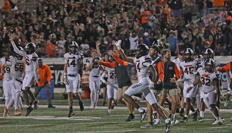 Spruce Creek High School coaching staff, team and crowd celebrate their victory over Mainland High School on Friday, Sept. 12, 2025 at Daytona Stadium.
