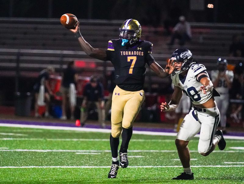 Booker's quarterback Joel Morris passes during Friday night's game against Naples on Sept. 12, 2025, in Sarasota.