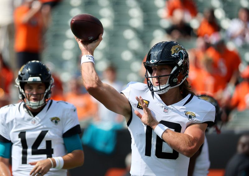 Sep 14, 2025; Cincinnati, Ohio, USA; Jacksonville Jaguars quarterback Trevor Lawrence (16) warms up before the game against the Cincinnati Bengals at Paycor Stadium. Mandatory Credit: Joseph Maiorana-Imagn Images