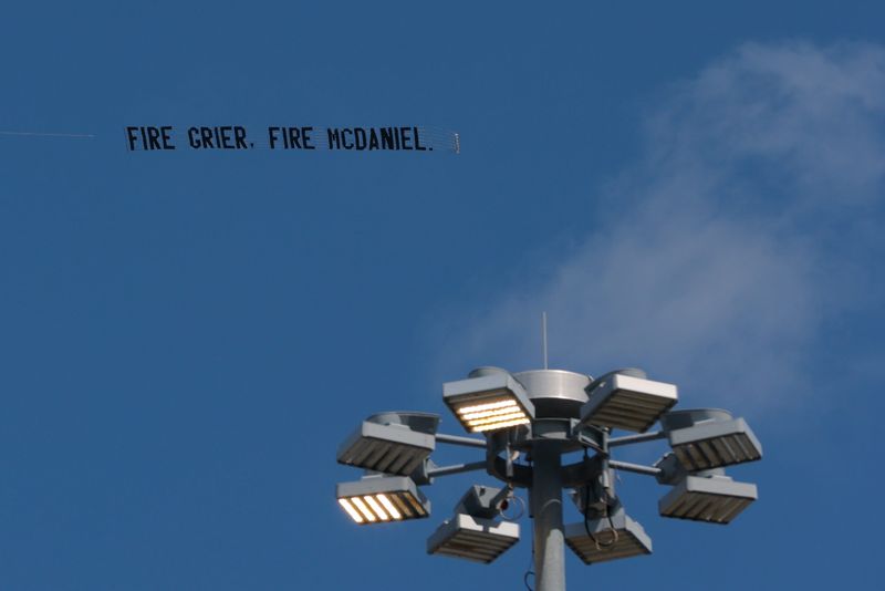 Sep 14, 2025; Miami Gardens, Florida, USA; A plane towing a banner flies over the stadium before a game between the Miami Dolphins and the New England Patriots at Hard Rock Stadium. Mandatory Credit: Sam Navarro-Imagn Images