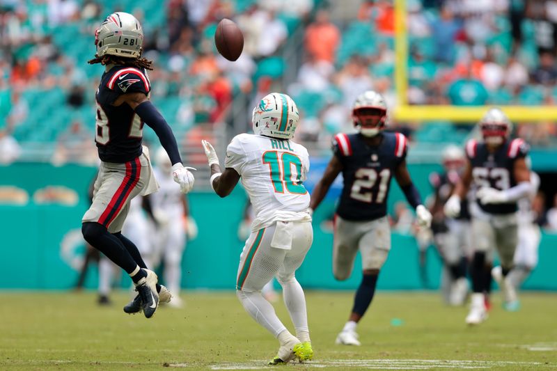 Sep 14, 2025; Miami Gardens, Florida, USA; Miami Dolphins wide receiver Tyreek Hill (10) catches a pass against the New England Patriots during the third quarter at Hard Rock Stadium. Mandatory Credit: Sam Navarro-Imagn Images