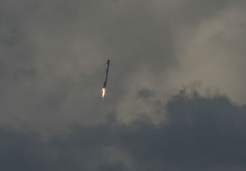 Spectators in Cocoa Beach watch the booster landing from the launch of a SpaceX Falcon 9 rocket carrying a Northrop Grumman Cygnus spacecraft full of supplies and science for NASA to the International Space Station. The liftoff was at 6:11 EDT Sunday, September 14th from Launch Complex 40 in Cape Canaveral Space Force Station with the booster landing back at the Space Force Station.