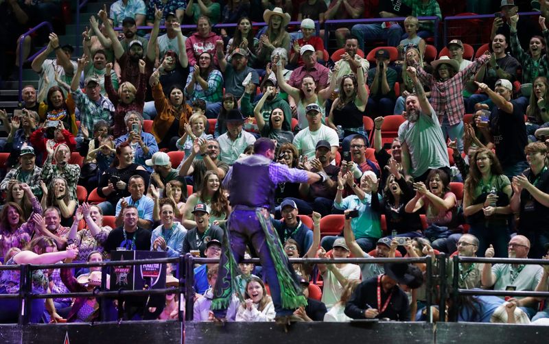 The crowd cheers for bull rider Alex Junior da Silva during the Professional Bull Riders Challenger Series on Sept. 13, 2025, at the Resch Center in Ashwaubenon, Wis. He won won the event with the highest-marked ride of the night.