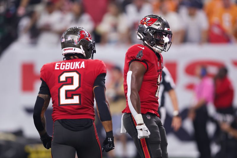 Sep 15, 2025; Houston, Texas, USA; Tampa Bay Buccaneers running back Rachaad White (1) celebrates after scoring a touchdown during the fourth quarter against the Houston Texans at NRG Stadium. Mandatory Credit: Troy Taormina-Imagn Images
