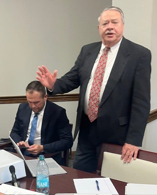 Dr. Ben Brown (sitting) waits with his lawyer Bruce Lamb during an administrative hearing over his medical license. The Florida Department of Health recommended he face further sanctions that could include the permanent revocation or a suspension of his license