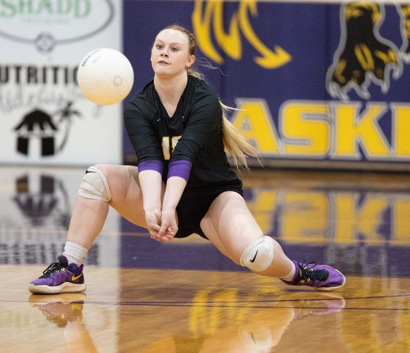 Union County defensive specialist Bayley Staier (15) returns a serve during an FHSAA volleyball match against Branford.