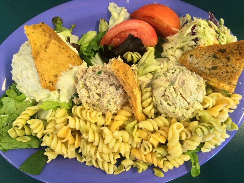 The Sampler at Clara's Tidbits features chicken salad, tuna salad, potato salad and coleslaw.
