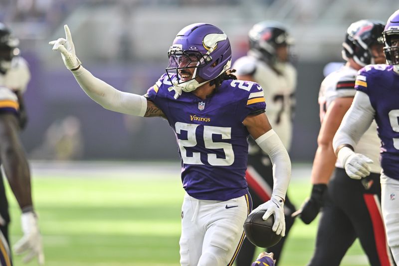 Aug 9, 2025; Minneapolis, Minnesota, USA; Minnesota Vikings cornerback Kahlef Hailassie (25) reacts after an interception during the fourth quarter against the Houston Texans at U.S. Bank Stadium. Mandatory Credit: Jeffrey Becker-Imagn Images