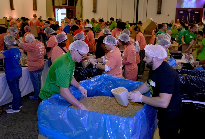 Volunteers pack pasta during the Palm Beach County Food Bank Pack to Give Back: Day of 200,000 Meals the Cohen Pavilion at the Kravis Center for the Performing Arts on Sept. 16.