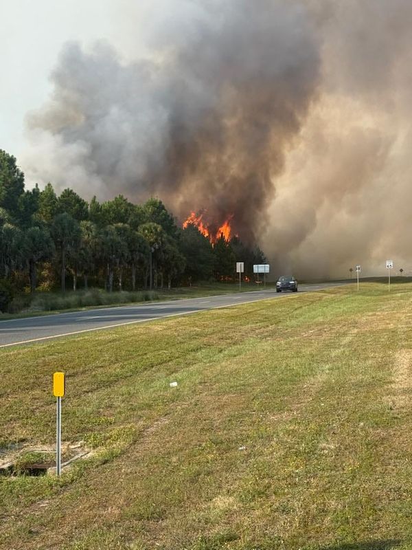 A fire jumped the line of a controlled burn, causing a brush fire to burn out of control on Sept. 17, 2025, in Panama City Beach.