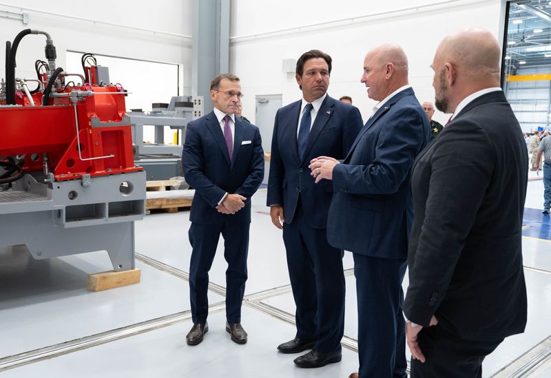 Florida Governor Ron DeSantis, second from left, gets a private tour of the facilities following the ribbon cutting ceremony for the new Leonardo Helicopters Florida Support Center in Milton on Sept. 18, 2025.