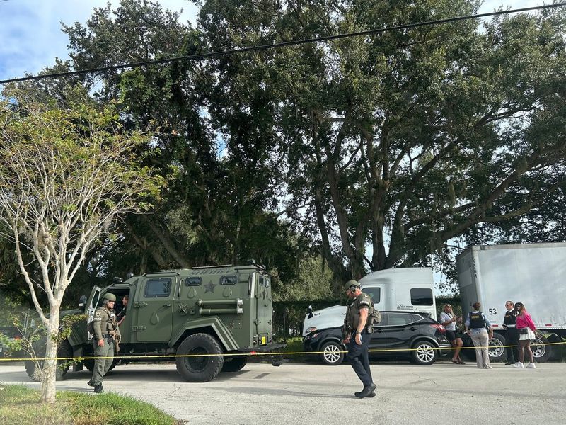 Cocoa police surround a home where a man barricaded himself with a shotgun, officials report.