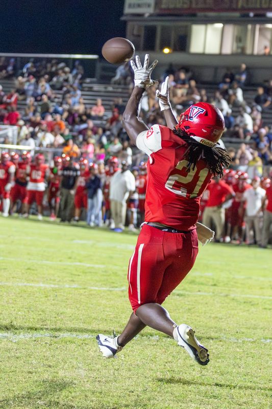 Vanguard Kemohn Pinkney (21) hauls in a touchdown pass during the second half of an FHSAA football game at Booster Stadium in Ocala, FL on Friday, September 19, 2025. [Alan Youngblood/Ocala Star-Banner]