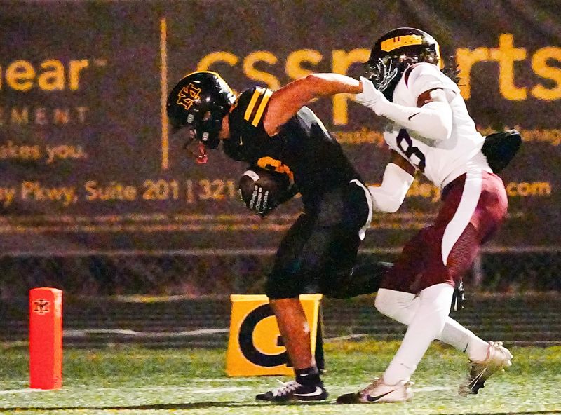 Drew Sarver of Merritt Island gets past St. Cloud defender Jeremiah Barnes for a touchdown during their game September 19, 2025. Craig Bailey, FLORIDA TODAY via USA TODAY NETWORK