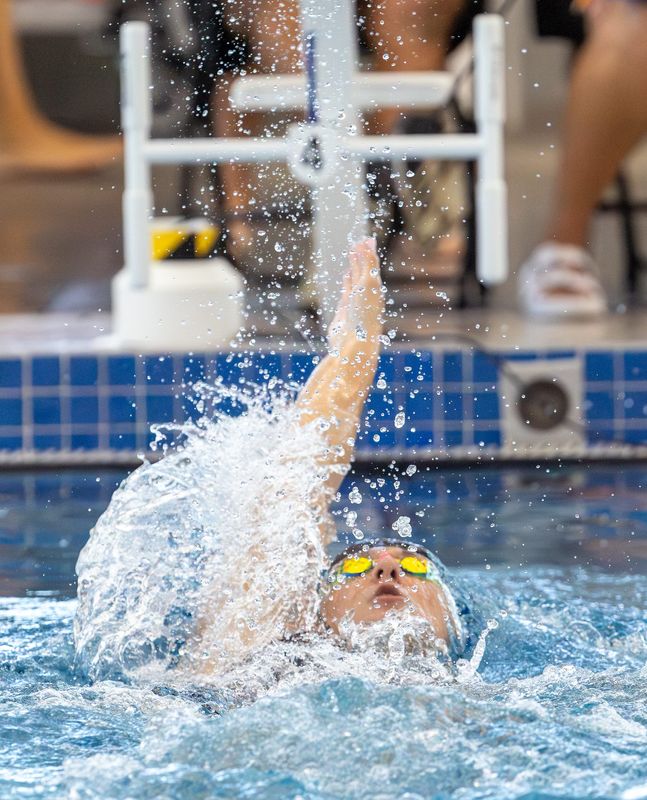 West Port’s Hannah Parkin swims the 100 yard backstroke during the 2025 MAC Championship at FAST in Ocala, FL on Saturday, September 20, 2025. [Alan Youngblood/Ocala Star-Banner]