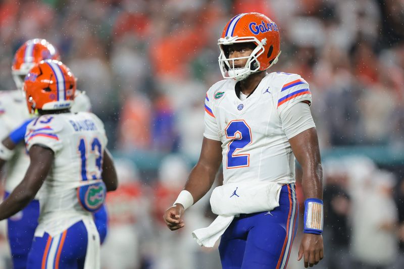 Sep 20, 2025; Miami Gardens, Florida, USA; Florida Gators quarterback DJ Lagway (2) looks on from the field against the Miami Hurricanes during the first quarter at Hard Rock Stadium. Mandatory Credit: Sam Navarro-Imagn Images