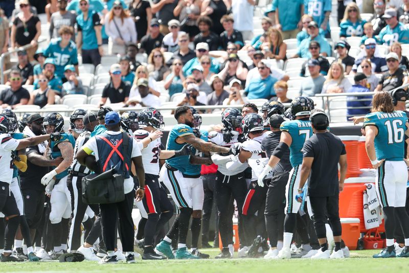 Jacksonville Jaguars and Houston Texans players scufffle along the Jaguars sideline during the second quarter of their game on Sept. 21 at EverBank Stadium in Jacksonville.